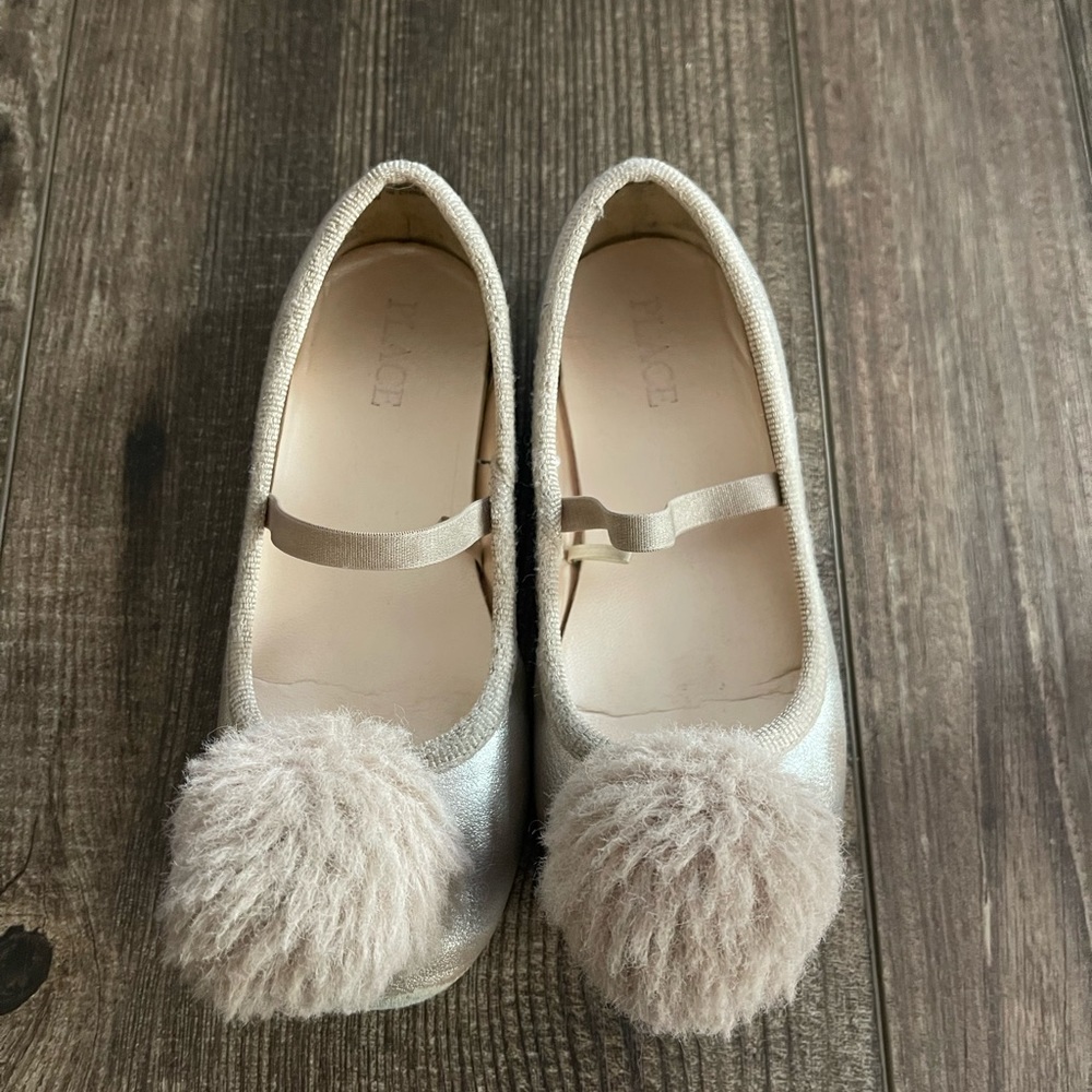Light pink pompom flats